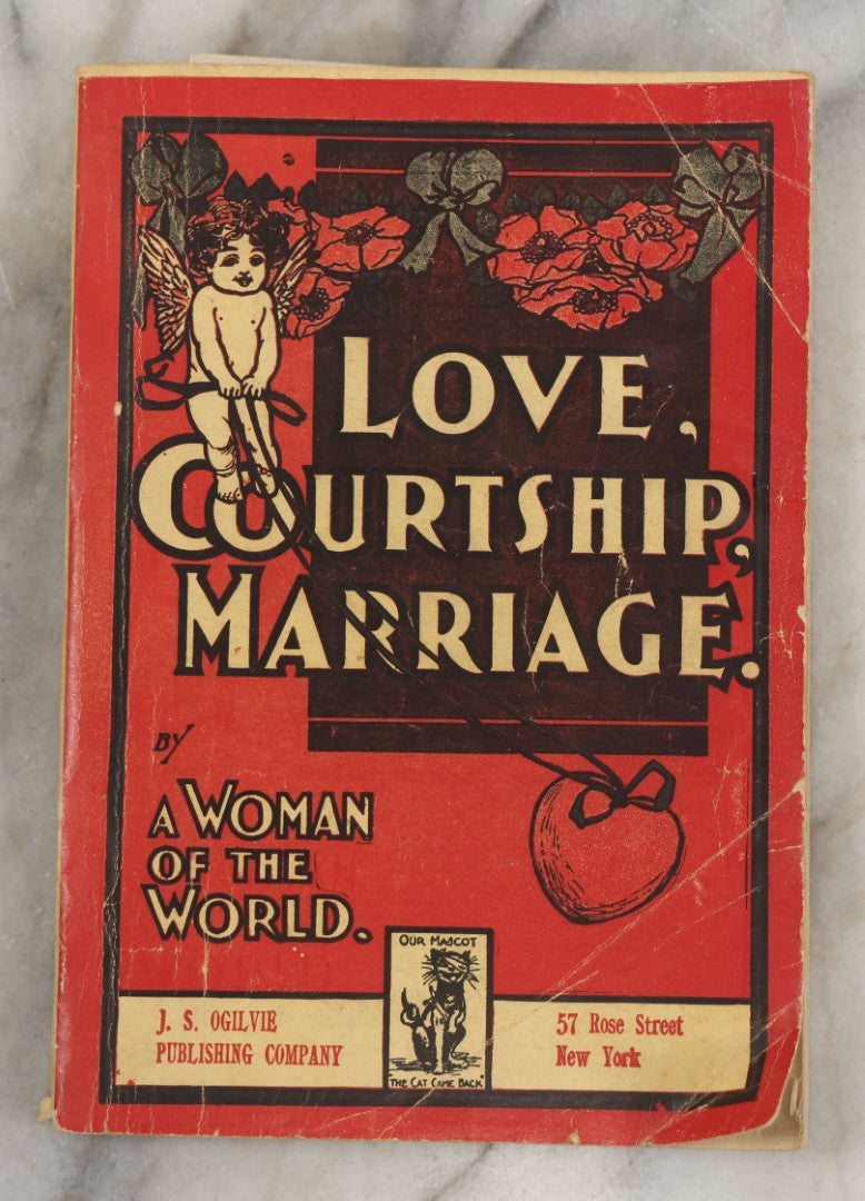 Lot 266 - "Love, Courtship, Marriage By A Woman Of The World" Antique Illustrated Paperback With Cupid Illustration On Cover And Bandaged Cat Mascot, J.S. Ogilvie, Publisher, New York, 1902, "A Hundred Ways Of Kissing Girls" Advertisement On Back Cover