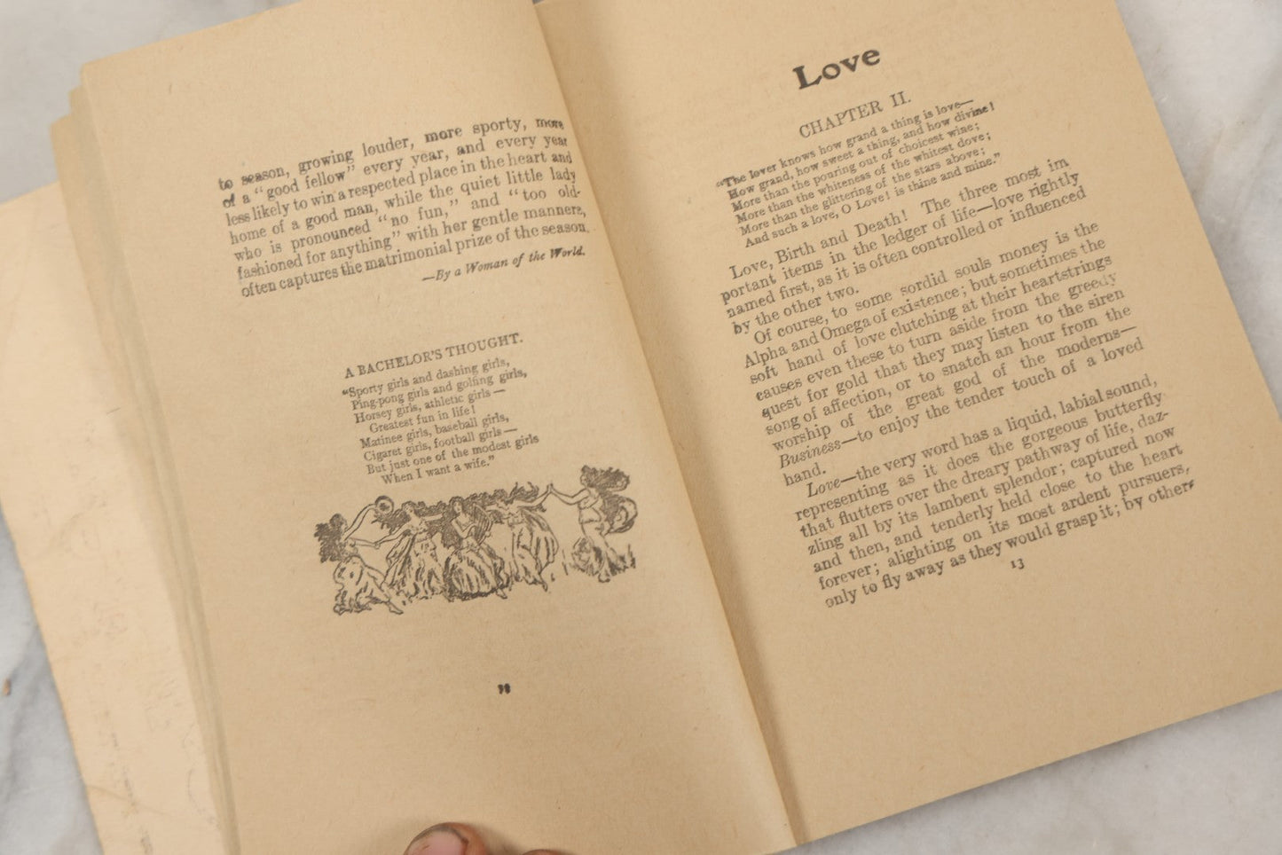 Lot 266 - "Love, Courtship, Marriage By A Woman Of The World" Antique Illustrated Paperback With Cupid Illustration On Cover And Bandaged Cat Mascot, J.S. Ogilvie, Publisher, New York, 1902, "A Hundred Ways Of Kissing Girls" Advertisement On Back Cover