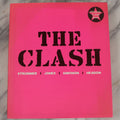 Lot 280 - "The Clash: Strummer, Jones, Simonon, Headon," Modern Book Of Band Photography And Interviews, "Original Clash Book" With Neon Pink Cover, Diorissimo Limited, Publisher, New York, 2008