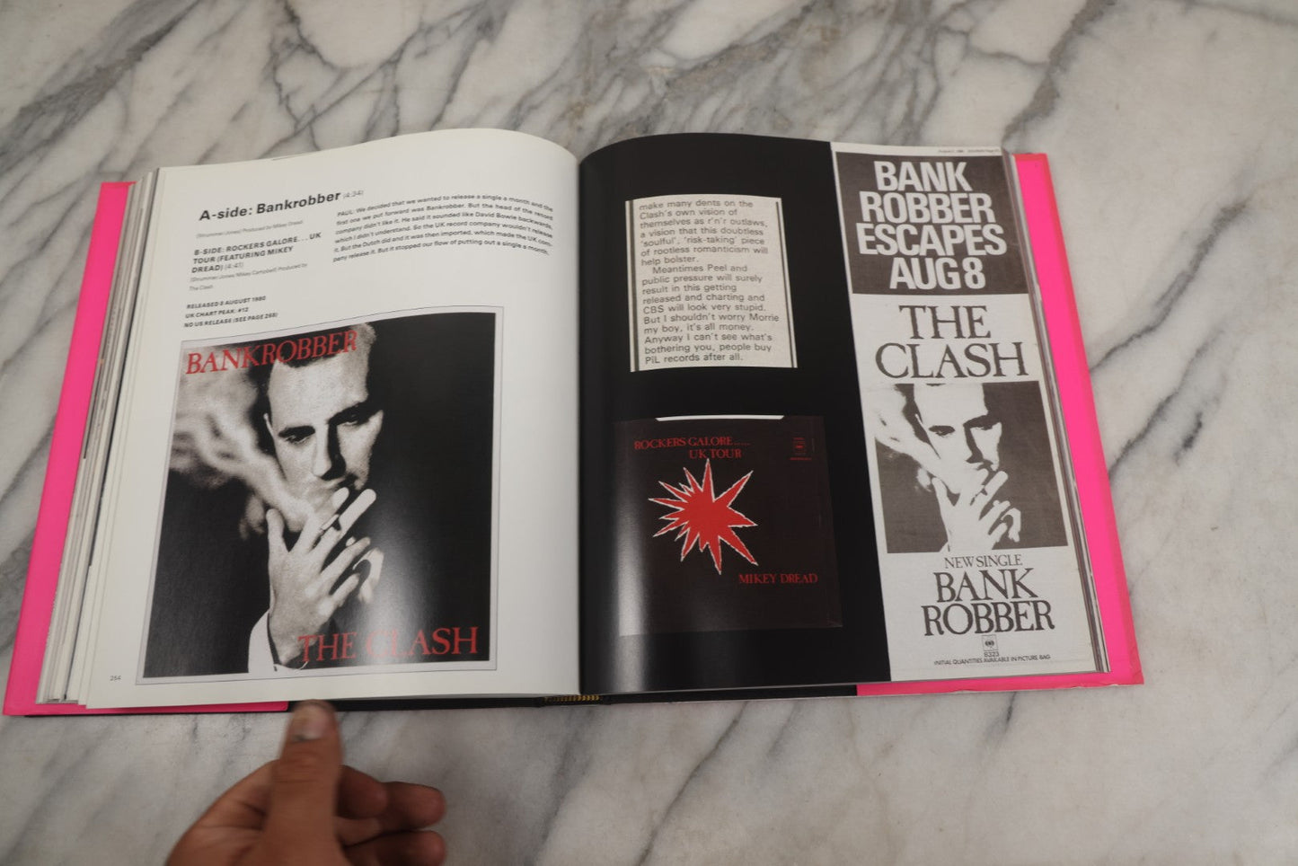 Lot 280 - "The Clash: Strummer, Jones, Simonon, Headon," Modern Book Of Band Photography And Interviews, "Original Clash Book" With Neon Pink Cover, Diorissimo Limited, Publisher, New York, 2008