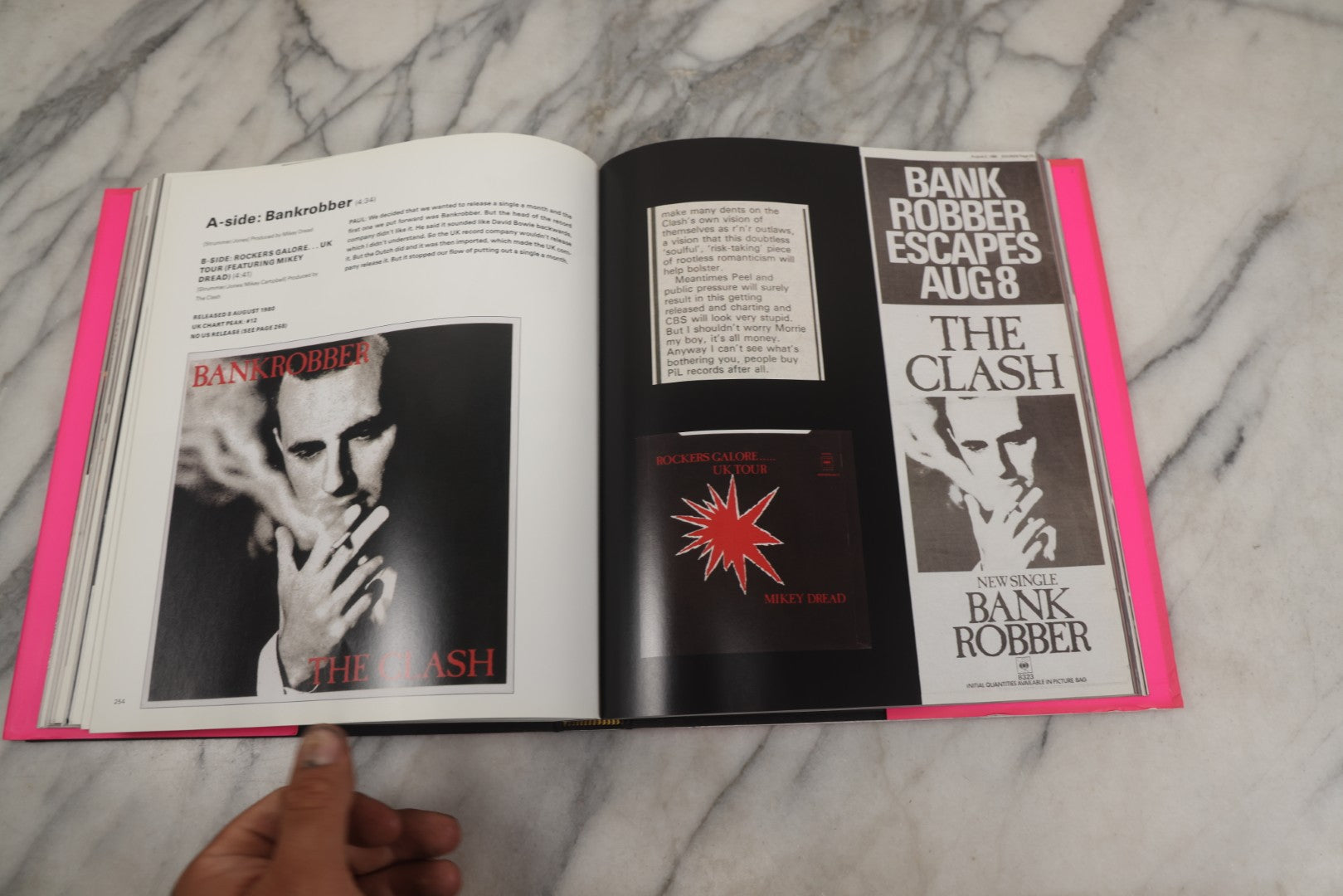 Lot 280 - "The Clash: Strummer, Jones, Simonon, Headon," Modern Book Of Band Photography And Interviews, "Original Clash Book" With Neon Pink Cover, Diorissimo Limited, Publisher, New York, 2008