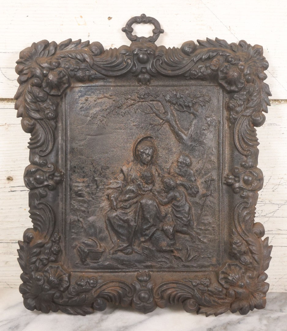Lot 010 - Antique Cast Iron Religious Plaque Depicting The Holy Family, Virgin Mary, Baby Jesus, And John The Baptist, Wall Hanging Decor, 10-1/2" x 12-1/2"