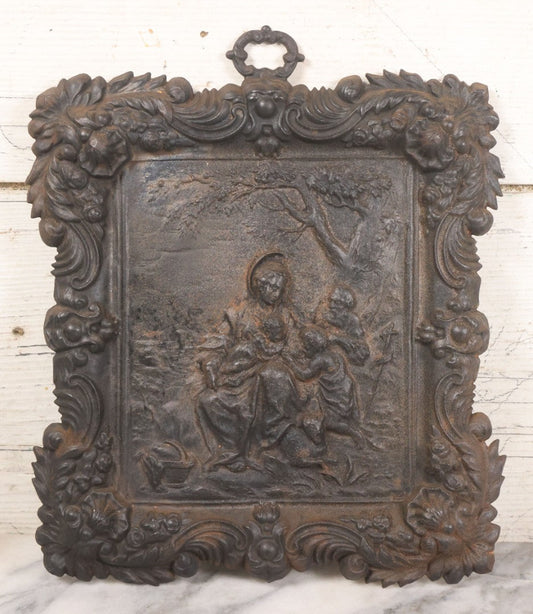 Lot 010 - Antique Cast Iron Religious Plaque Depicting The Holy Family, Virgin Mary, Baby Jesus, And John The Baptist, Wall Hanging Decor, 10-1/2" x 12-1/2"