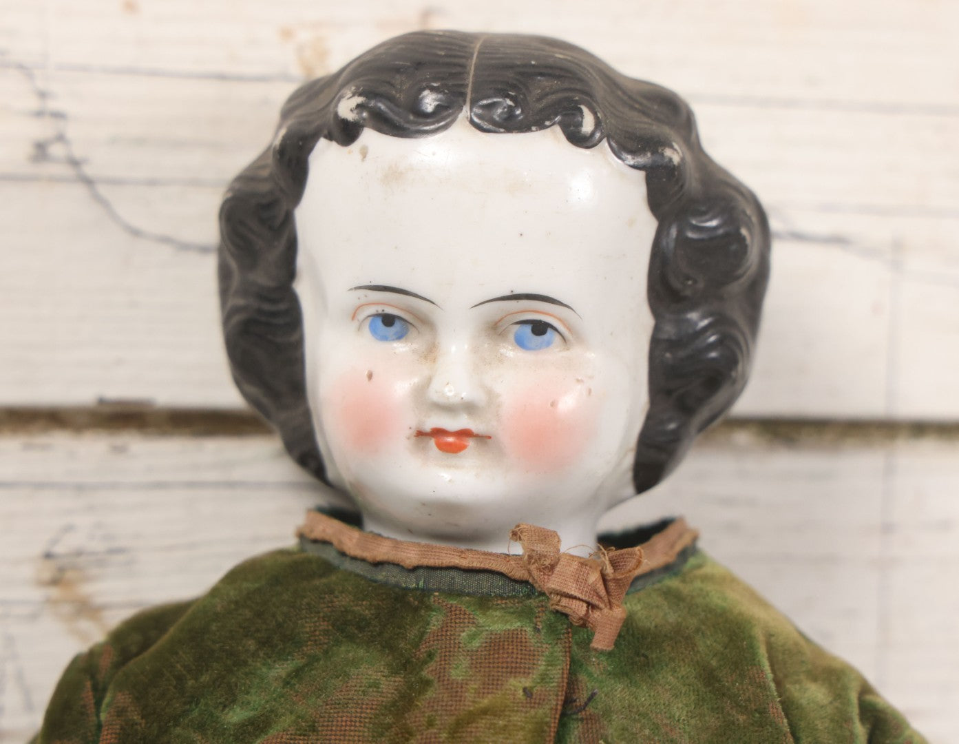 Lot 011 - Antique Victorian China Head Doll With Custom Outfit Including Velvet Blazer, Green, Pink, Yellow, And Black Striped Skirt, Knit Underskirt, White And Pink Pantyhose, And Black Stockings, 20" H