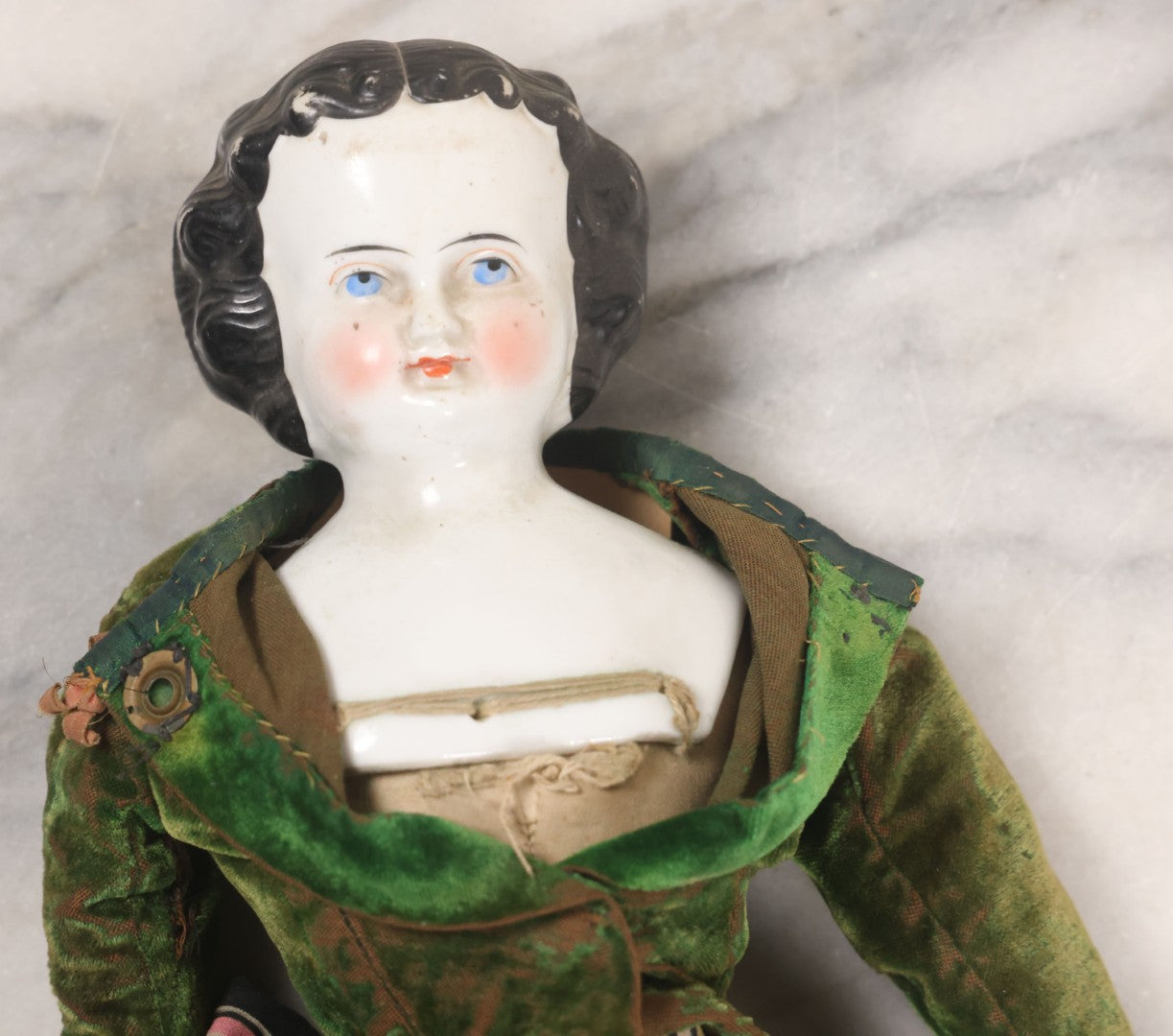 Lot 011 - Antique Victorian China Head Doll With Custom Outfit Including Velvet Blazer, Green, Pink, Yellow, And Black Striped Skirt, Knit Underskirt, White And Pink Pantyhose, And Black Stockings, 20" H