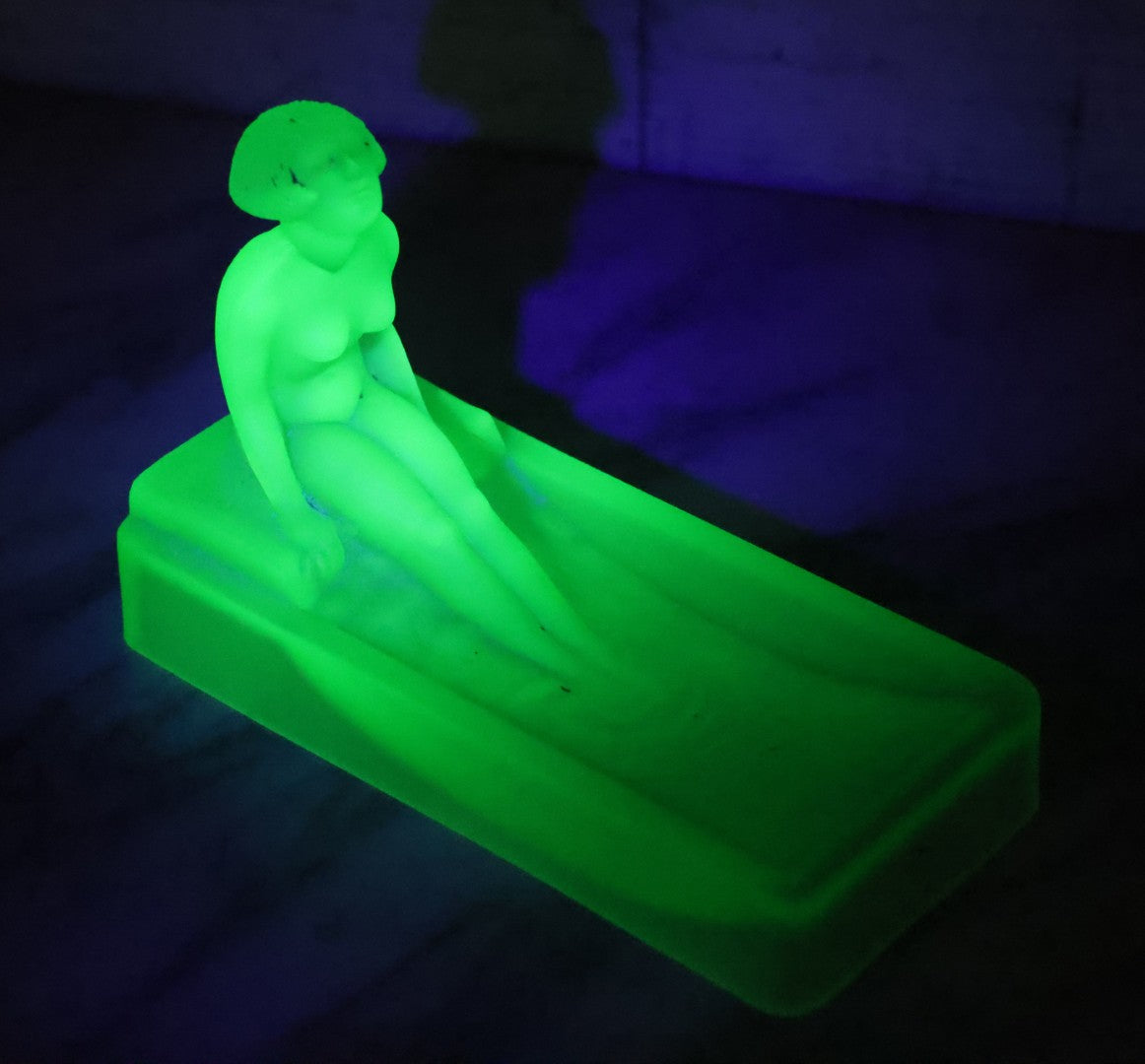 Lot 012 - Vintage Art Deco Uranium Satin Glass Trinket Or Soap Dish, Molded In Green Glass With Seated Nude Female Figure, Circa 1920s–1930s Glows Under Black Light