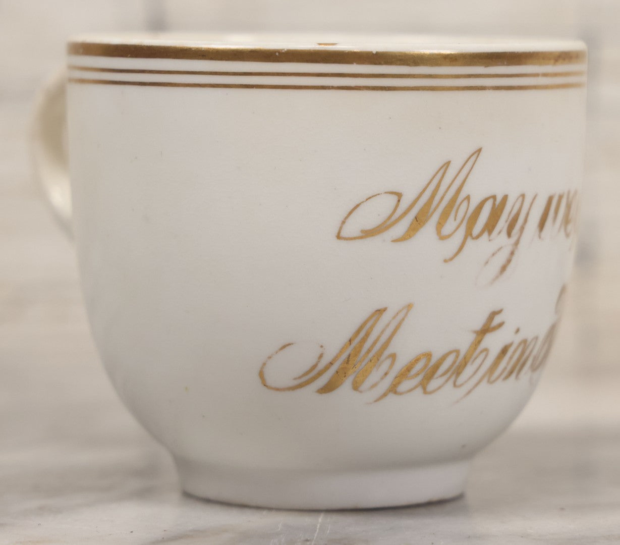 Lot 021 - Antique Porcelain Teacup With Motto "May We All Meet In Heaven," White Porcelain With Gold Painted Lettering, Striping
