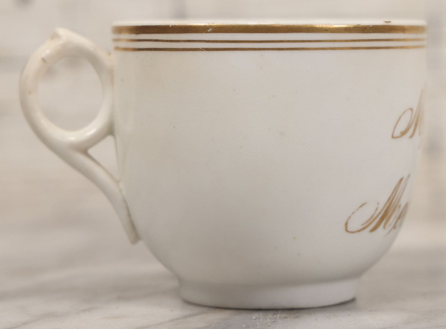 Lot 021 - Antique Porcelain Teacup With Motto "May We All Meet In Heaven," White Porcelain With Gold Painted Lettering, Striping