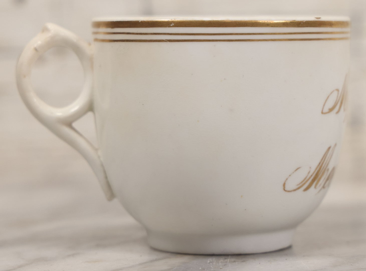 Lot 021 - Antique Porcelain Teacup With Motto "May We All Meet In Heaven," White Porcelain With Gold Painted Lettering, Striping
