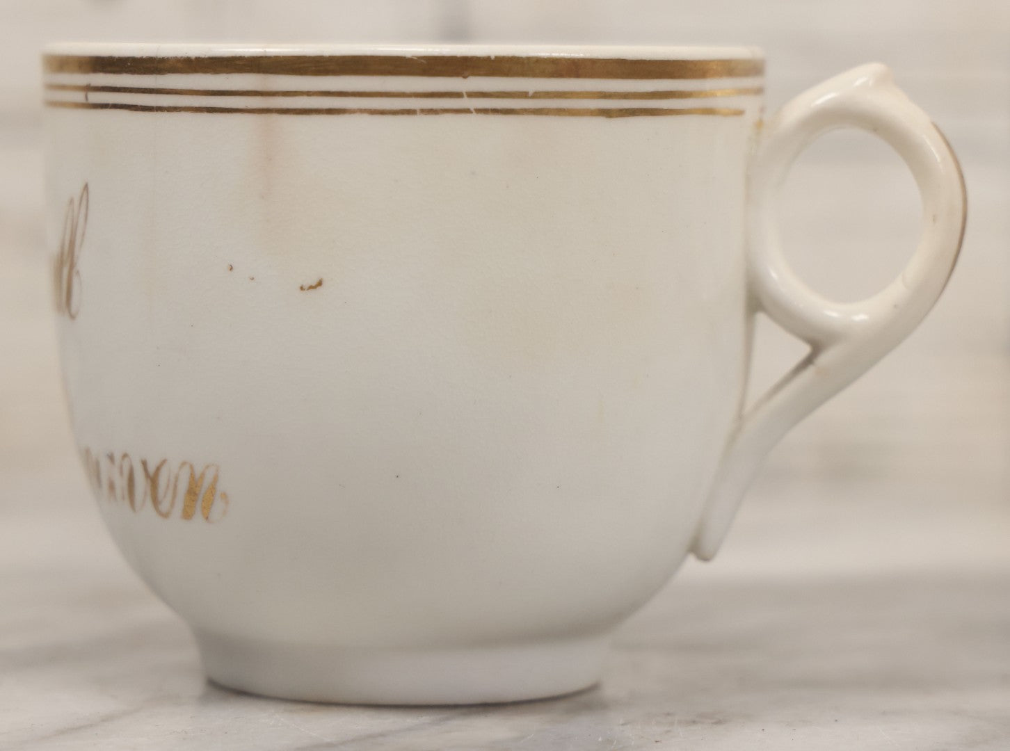 Lot 021 - Antique Porcelain Teacup With Motto "May We All Meet In Heaven," White Porcelain With Gold Painted Lettering, Striping