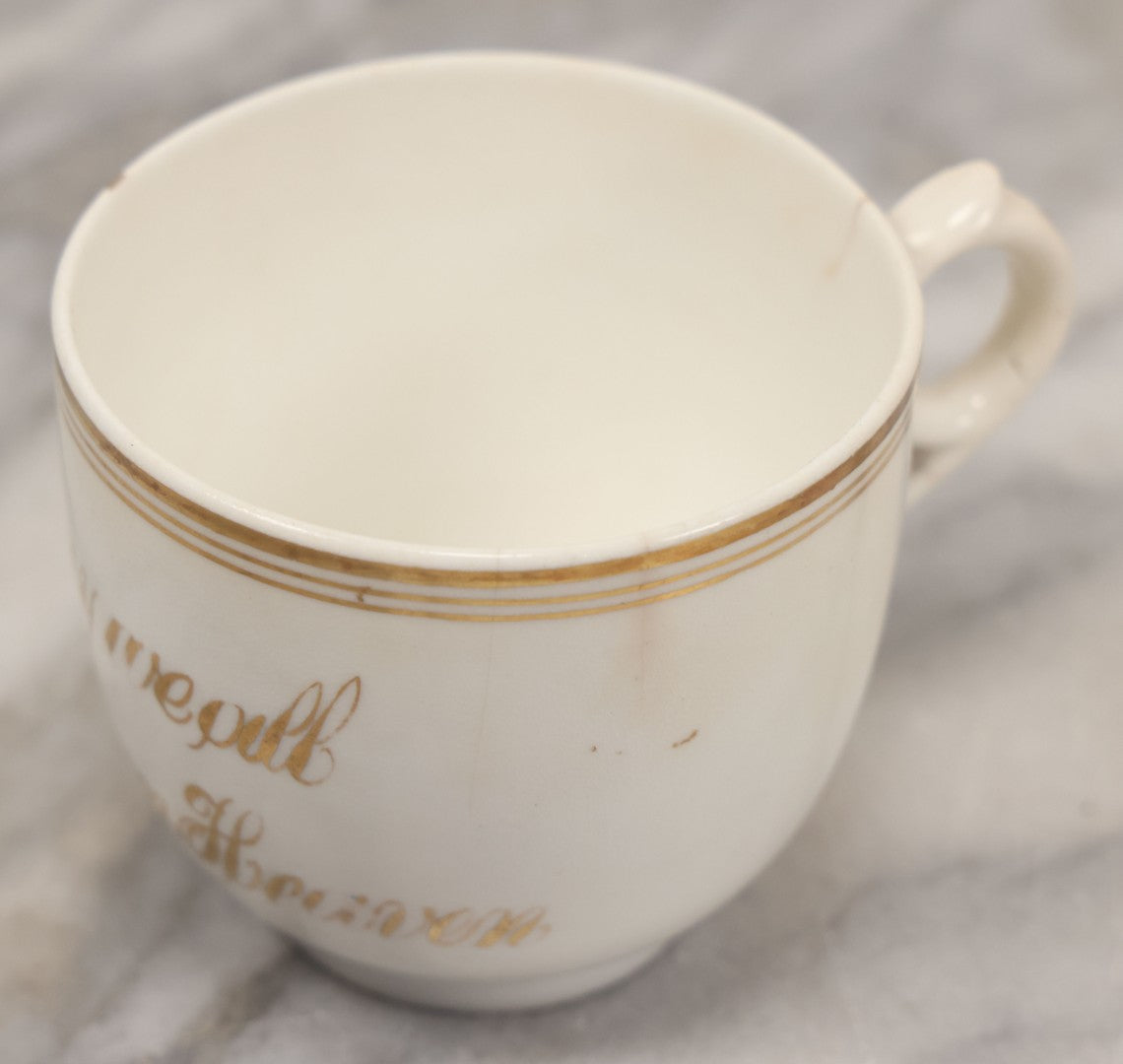 Lot 021 - Antique Porcelain Teacup With Motto "May We All Meet In Heaven," White Porcelain With Gold Painted Lettering, Striping