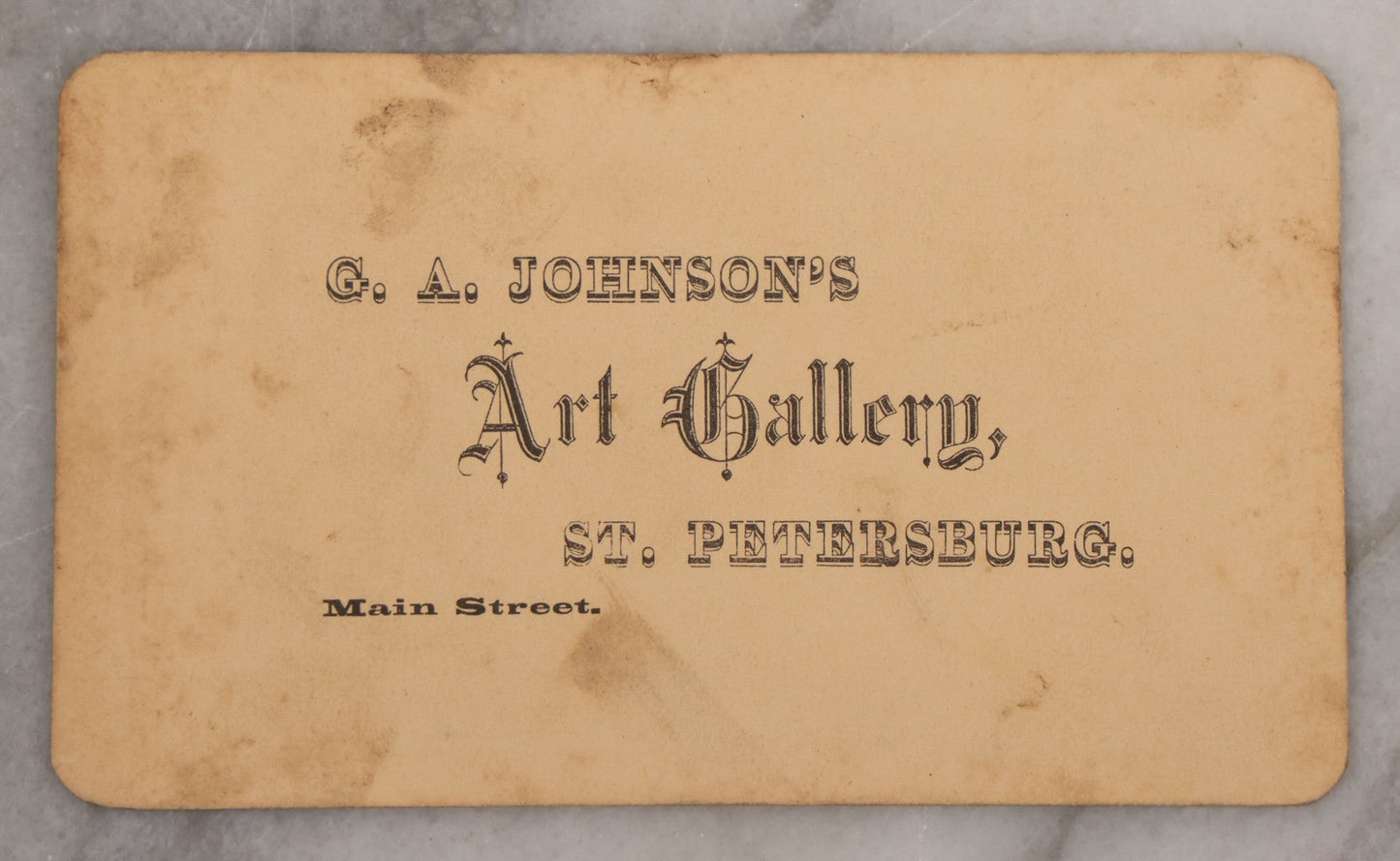 Lot 025 - Antique Post Mortem Carte De Visite C.D.V. Photograph Of A Deceased Toddler Lying At Rest, With Flower Beside Head, Photographed at G.A. Johnson's Art Gallery, St. Petersburg, Florida