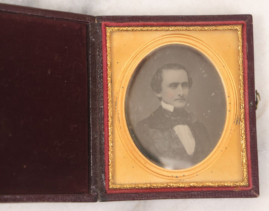 Lot 027 - Antique 1/6th Plate Daguerreotype Photograph Of A Middle Aged Man, Photographed By McClees & Germon, Philadelphia Pennsylvania, Marked On Brass Mat, In Full Intact Leatherette Union Case, Circa 1850