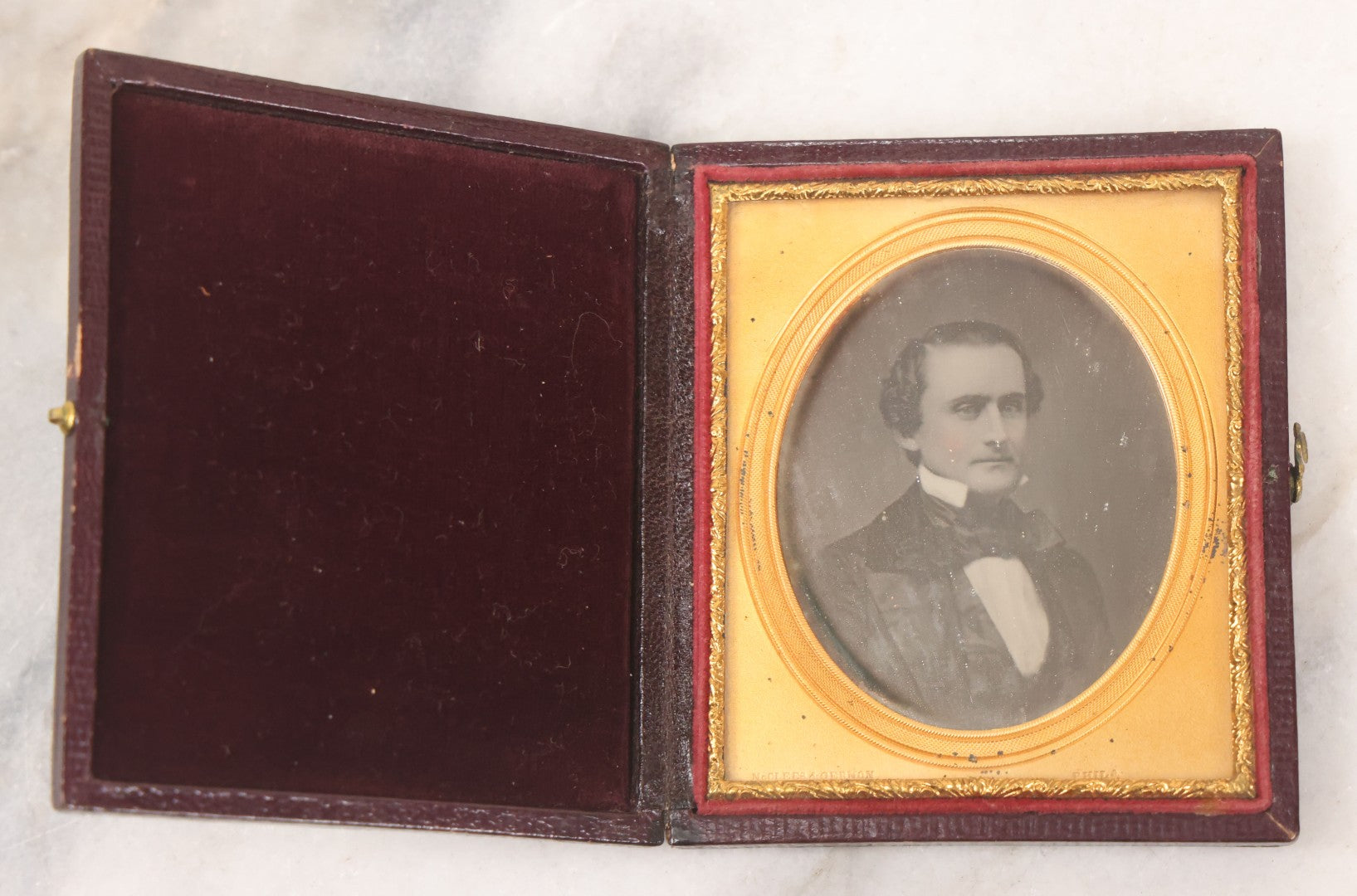 Lot 027 - Antique 1/6th Plate Daguerreotype Photograph Of A Middle Aged Man, Photographed By McClees & Germon, Philadelphia Pennsylvania, Marked On Brass Mat, In Full Intact Leatherette Union Case, Circa 1850
