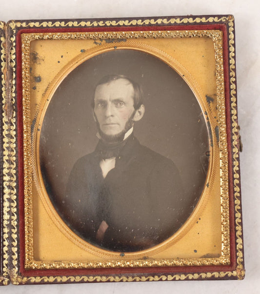 Lot 028 - Antique 1/6th Plate Daguerreotype Photograph Of A Middle Aged Man With A Chin Strap Beard, Photographed By Bell & Clayton, Philadelphia, Marked On Case Pillow, In Full Intact Leatherette Union Case, Circa 1855