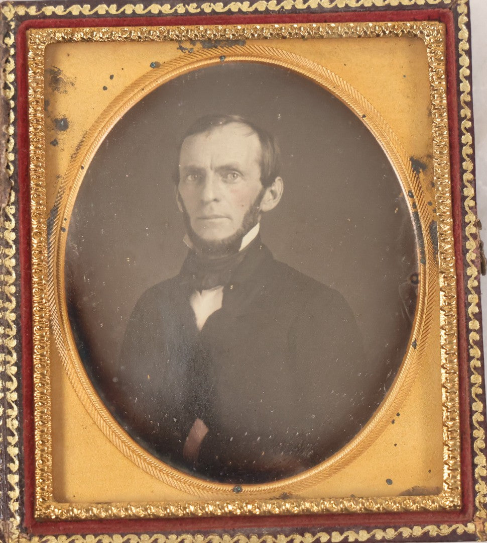 Lot 028 - Antique 1/6th Plate Daguerreotype Photograph Of A Middle Aged Man With A Chin Strap Beard, Photographed By Bell & Clayton, Philadelphia, Marked On Case Pillow, In Full Intact Leatherette Union Case, Circa 1855