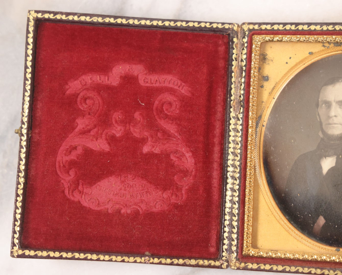 Lot 028 - Antique 1/6th Plate Daguerreotype Photograph Of A Middle Aged Man With A Chin Strap Beard, Photographed By Bell & Clayton, Philadelphia, Marked On Case Pillow, In Full Intact Leatherette Union Case, Circa 1855