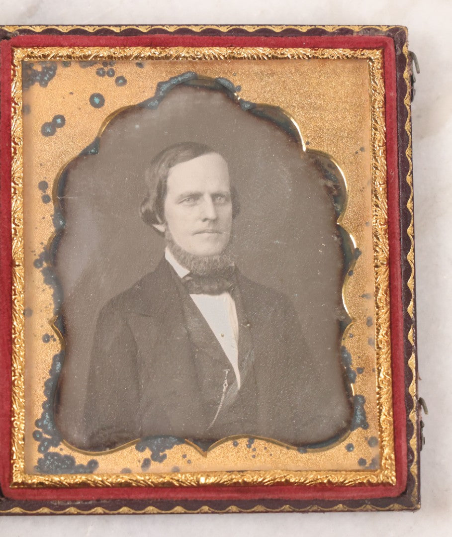 Lot 029 - Antique 1/6th Plate Daguerreotype Photograph Of A Middle Aged Man With A Bushy Chin Beard, In Full Intact Leatherette Union Case With Girl Throwing Flowers, Butterflies