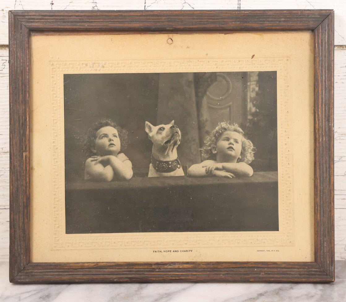 Lot 034 - Antique Comic Collectible Photo, Allegorical Three Theological Virtues, "Faith, Hope, And Charity" Depicted By Two Children And Their Dog, Copyright 1909 By R. Hill, In Frame, 12-1/8" x 10-1/8"