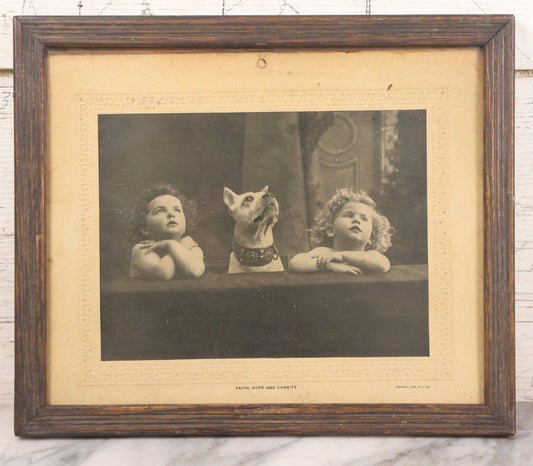 Lot 034 - Antique Comic Collectible Photo, Allegorical Three Theological Virtues, "Faith, Hope, And Charity" Depicted By Two Children And Their Dog, Copyright 1909 By R. Hill, In Frame, 12-1/8" x 10-1/8"