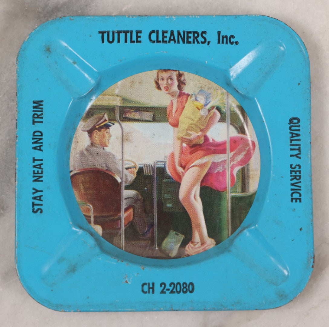 Lot 036 - Vintage Tin Lithograph Pin-Up Advertising Ashtray, With Woman Getting On Bus, Skirt Blowing In The Wind, Advertising Tuttle Cleaners, Inc., Chicago, "Quality Service, Stay Neat And Trim," 4-1/8" x 4-1/8"