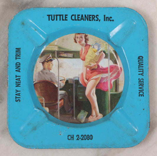 Lot 036 - Vintage Tin Lithograph Pin-Up Advertising Ashtray, With Woman Getting On Bus, Skirt Blowing In The Wind, Advertising Tuttle Cleaners, Inc., Chicago, "Quality Service, Stay Neat And Trim," 4-1/8" x 4-1/8"