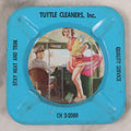 Lot 036 - Vintage Tin Lithograph Pin-Up Advertising Ashtray, With Woman Getting On Bus, Skirt Blowing In The Wind, Advertising Tuttle Cleaners, Inc., Chicago, "Quality Service, Stay Neat And Trim," 4-1/8" x 4-1/8"