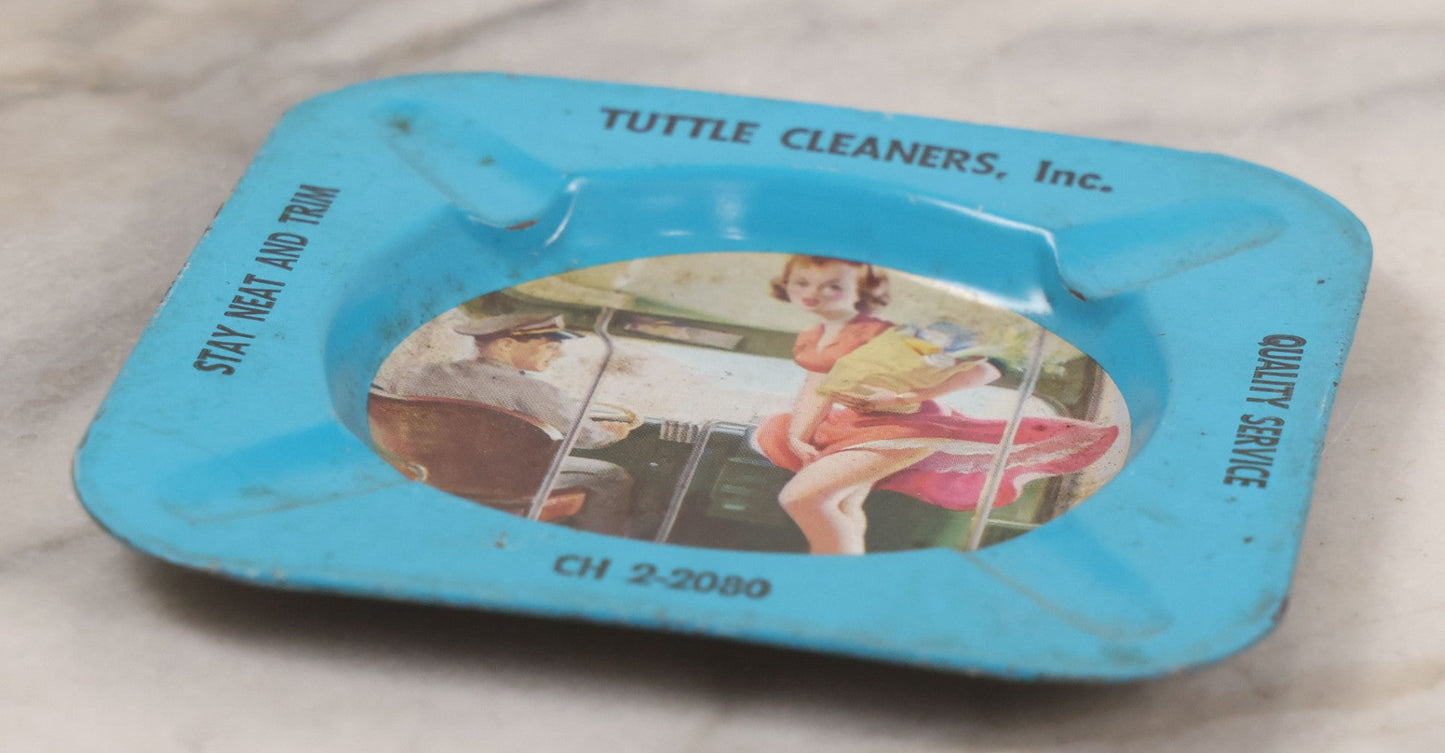 Lot 036 - Vintage Tin Lithograph Pin-Up Advertising Ashtray, With Woman Getting On Bus, Skirt Blowing In The Wind, Advertising Tuttle Cleaners, Inc., Chicago, "Quality Service, Stay Neat And Trim," 4-1/8" x 4-1/8"