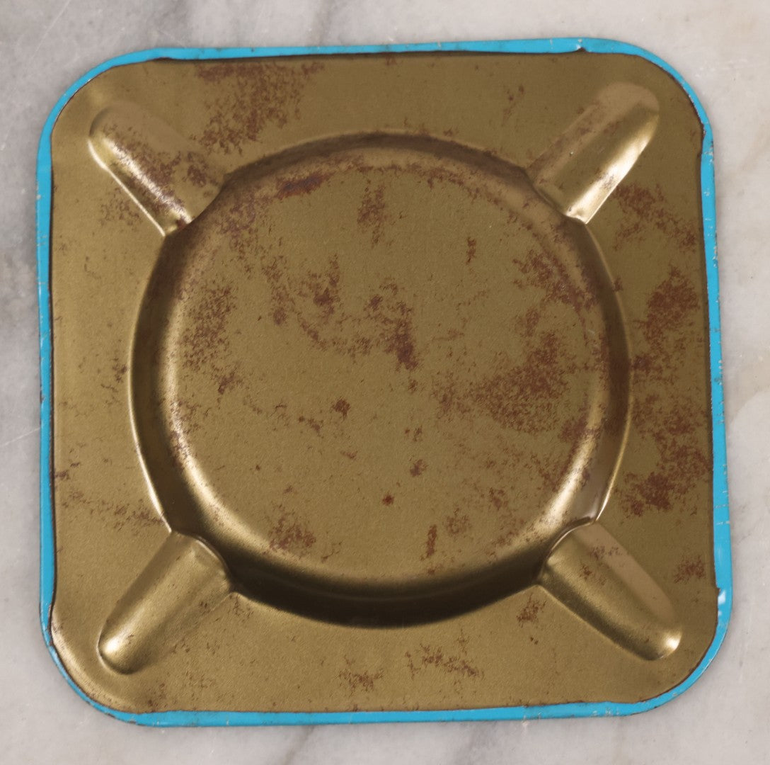 Lot 036 - Vintage Tin Lithograph Pin-Up Advertising Ashtray, With Woman Getting On Bus, Skirt Blowing In The Wind, Advertising Tuttle Cleaners, Inc., Chicago, "Quality Service, Stay Neat And Trim," 4-1/8" x 4-1/8"