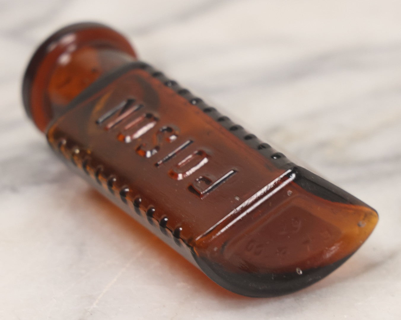 Lot 044 - Grouping Of Three Vintage Amber Glass Poison Bottles Including Tincture Of Iodine Bottle With Skull And Crossbones, Others With Embossed "Poison" Lettering, 2" and 3-5/8" Heights