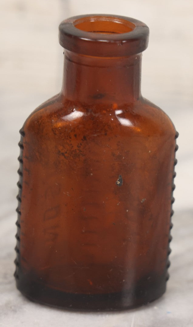 Lot 044 - Grouping Of Three Vintage Amber Glass Poison Bottles Including Tincture Of Iodine Bottle With Skull And Crossbones, Others With Embossed "Poison" Lettering, 2" and 3-5/8" Heights