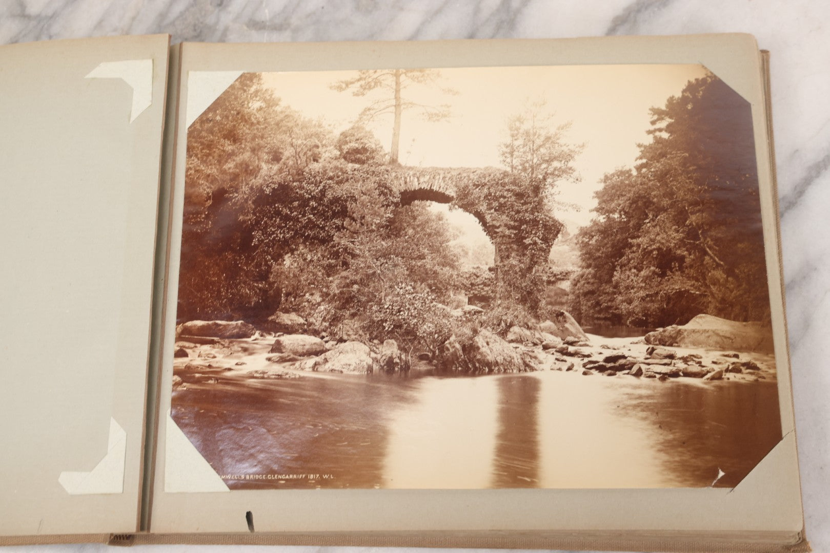 Lot 070 - Antique Photo Album With Approximately 80 Souvenir Photographs Of Landmarks Around Europe, England Including Churches And Cathedrals, Bridges, Architecture, Interiors, And Graveyards, Contained In "The Photo-Bind" Trademarked Album By J.H.H.M.