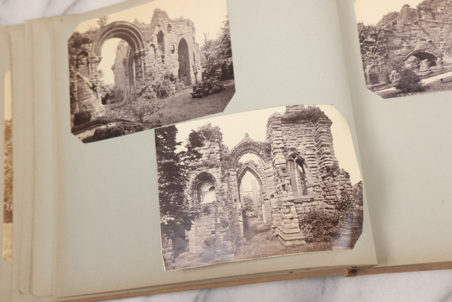 Lot 070 - Antique Photo Album With Approximately 80 Souvenir Photographs Of Landmarks Around Europe, England Including Churches And Cathedrals, Bridges, Architecture, Interiors, And Graveyards, Contained In "The Photo-Bind" Trademarked Album By J.H.H.M.