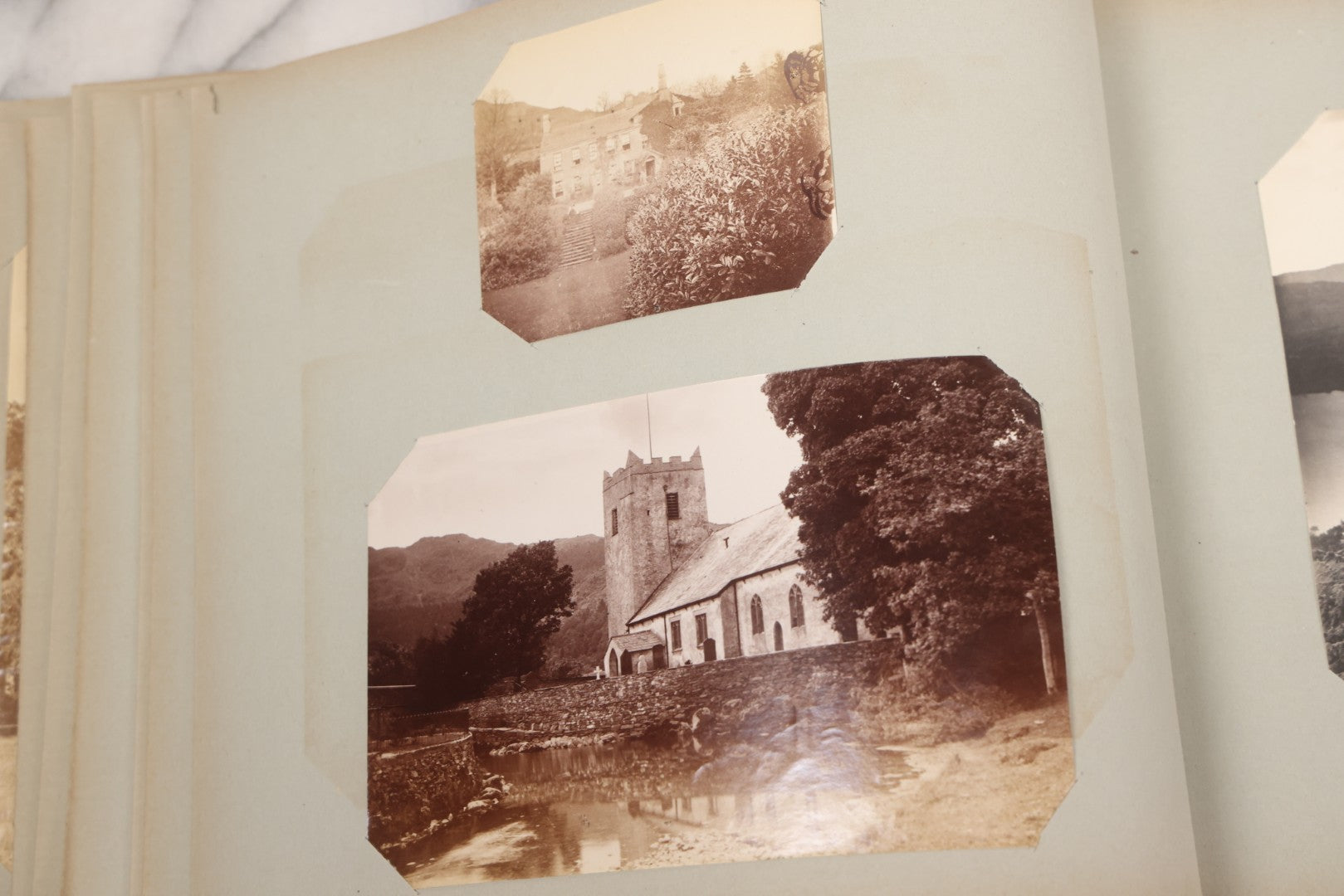 Lot 070 - Antique Photo Album With Approximately 80 Souvenir Photographs Of Landmarks Around Europe, England Including Churches And Cathedrals, Bridges, Architecture, Interiors, And Graveyards, Contained In "The Photo-Bind" Trademarked Album By J.H.H.M.