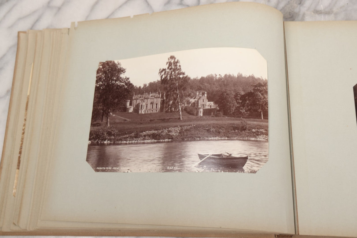 Lot 070 - Antique Photo Album With Approximately 80 Souvenir Photographs Of Landmarks Around Europe, England Including Churches And Cathedrals, Bridges, Architecture, Interiors, And Graveyards, Contained In "The Photo-Bind" Trademarked Album By J.H.H.M.