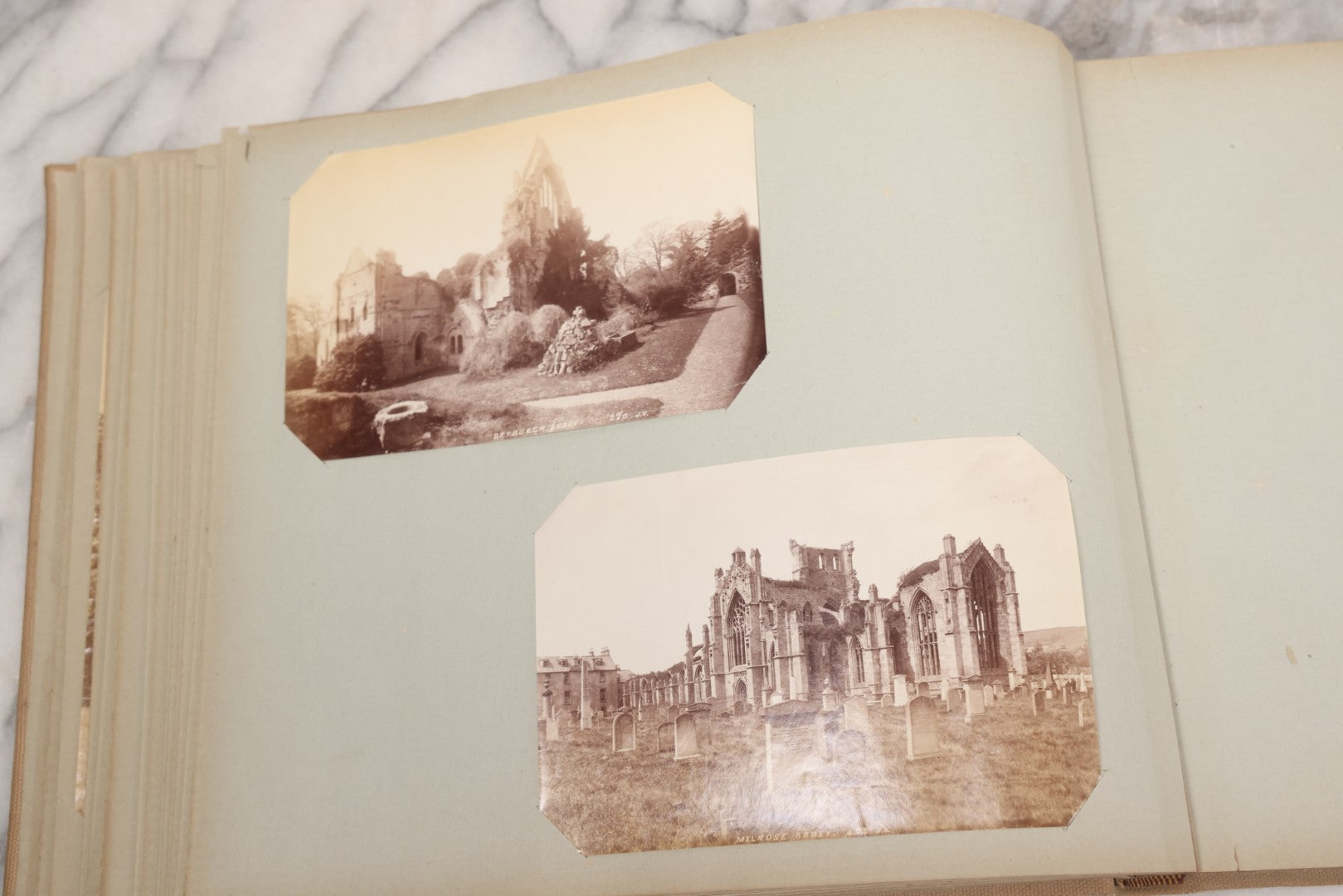 Lot 070 - Antique Photo Album With Approximately 80 Souvenir Photographs Of Landmarks Around Europe, England Including Churches And Cathedrals, Bridges, Architecture, Interiors, And Graveyards, Contained In "The Photo-Bind" Trademarked Album By J.H.H.M.