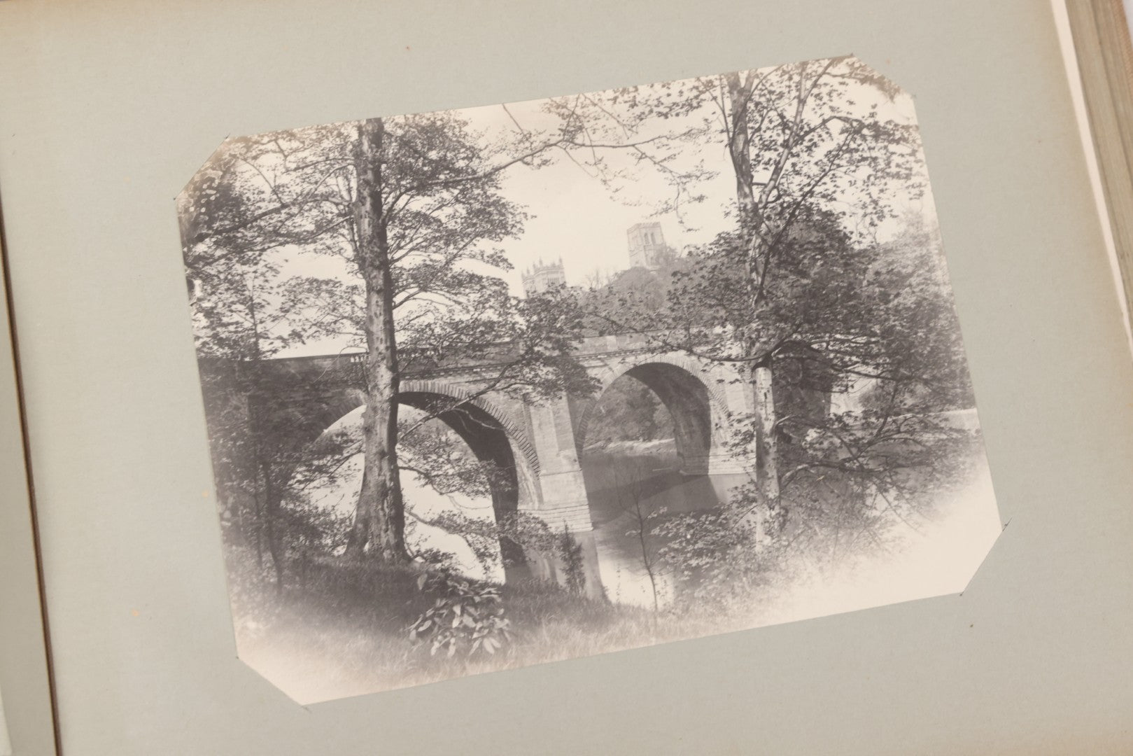 Lot 070 - Antique Photo Album With Approximately 80 Souvenir Photographs Of Landmarks Around Europe, England Including Churches And Cathedrals, Bridges, Architecture, Interiors, And Graveyards, Contained In "The Photo-Bind" Trademarked Album By J.H.H.M.