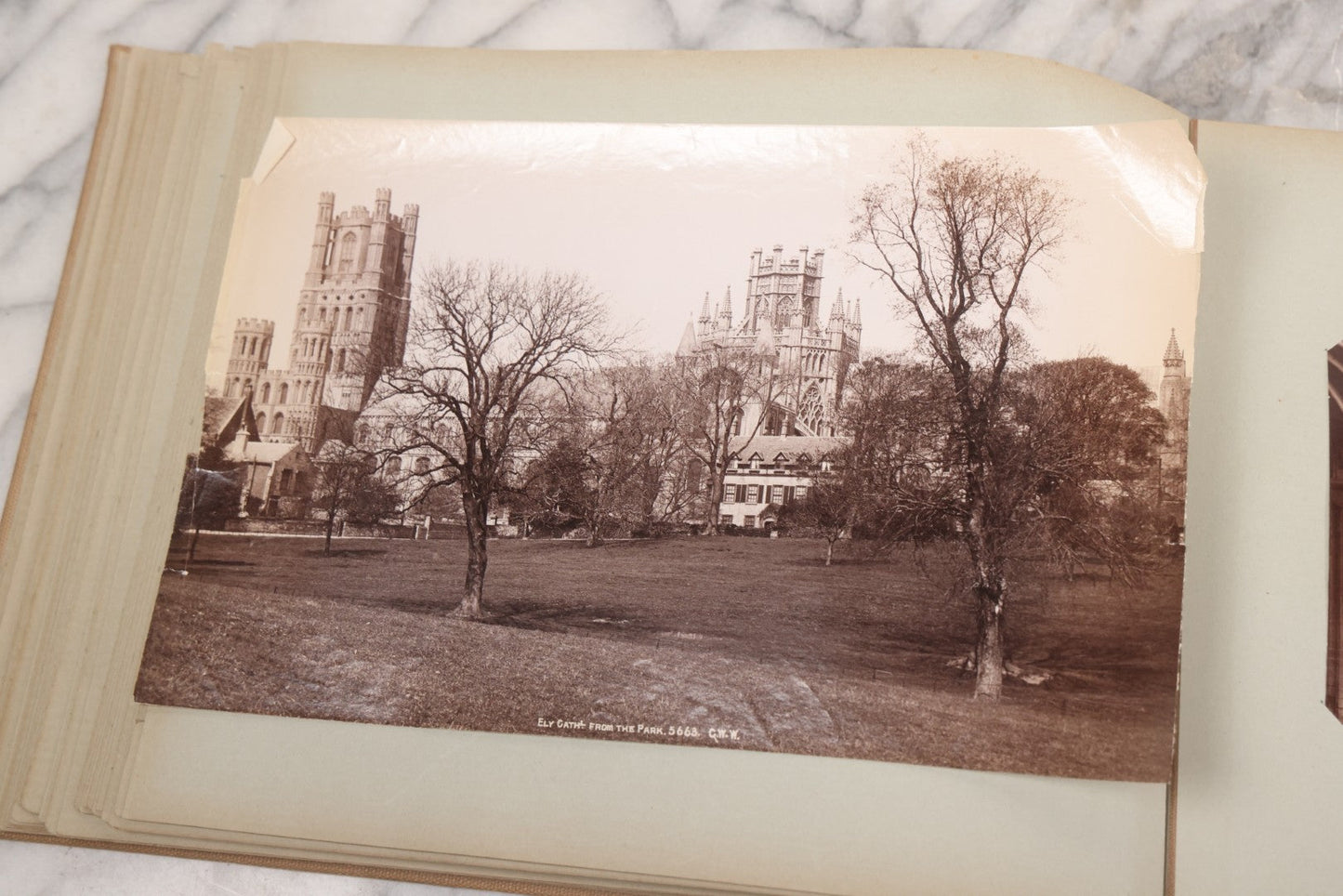 Lot 070 - Antique Photo Album With Approximately 80 Souvenir Photographs Of Landmarks Around Europe, England Including Churches And Cathedrals, Bridges, Architecture, Interiors, And Graveyards, Contained In "The Photo-Bind" Trademarked Album By J.H.H.M.
