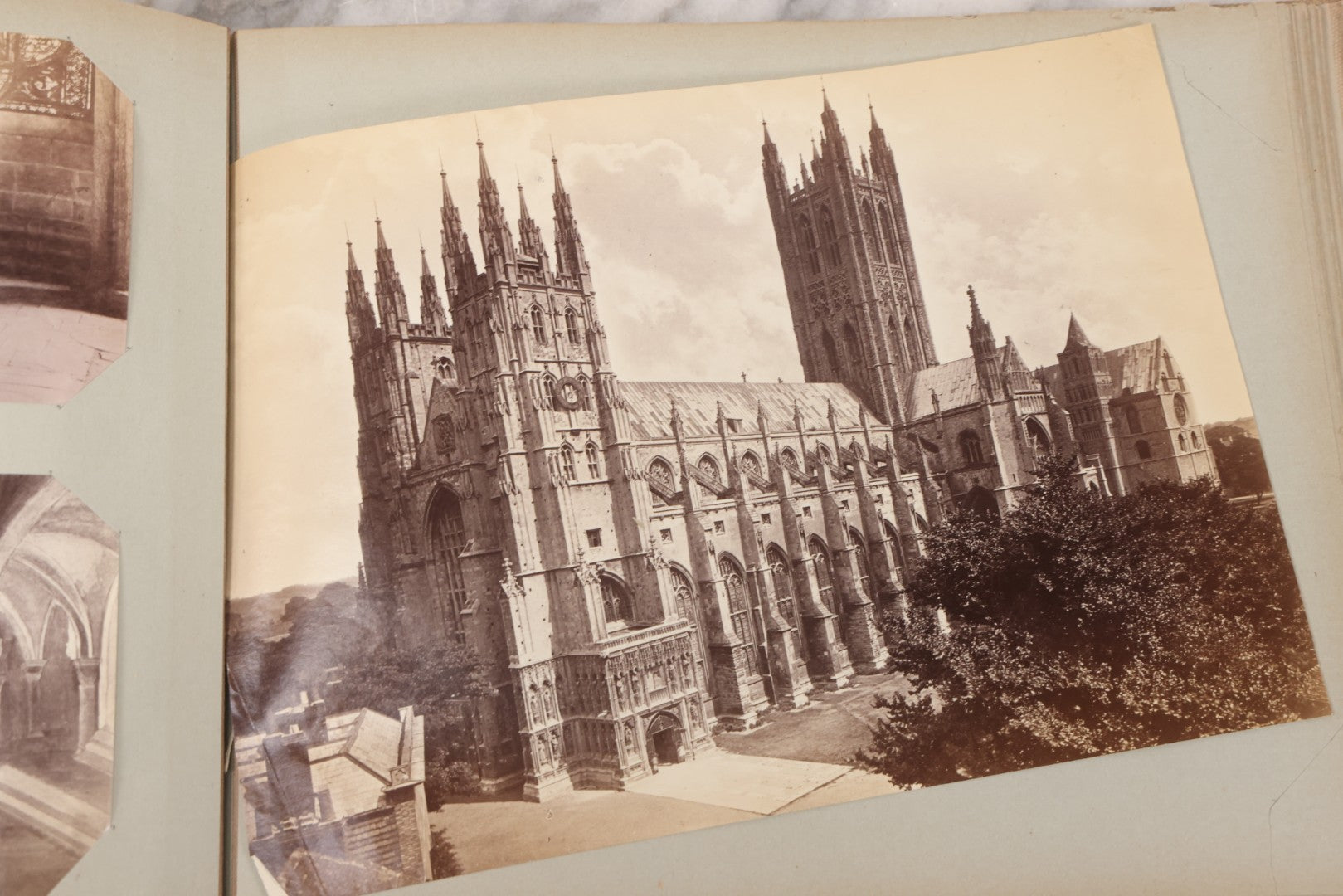 Lot 070 - Antique Photo Album With Approximately 80 Souvenir Photographs Of Landmarks Around Europe, England Including Churches And Cathedrals, Bridges, Architecture, Interiors, And Graveyards, Contained In "The Photo-Bind" Trademarked Album By J.H.H.M.