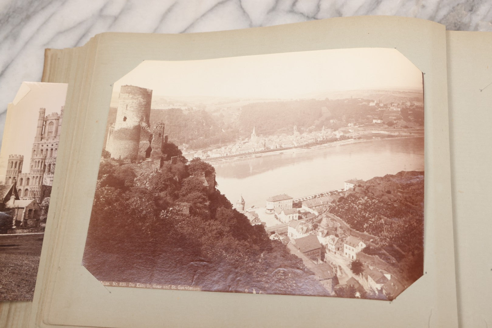 Lot 070 - Antique Photo Album With Approximately 80 Souvenir Photographs Of Landmarks Around Europe, England Including Churches And Cathedrals, Bridges, Architecture, Interiors, And Graveyards, Contained In "The Photo-Bind" Trademarked Album By J.H.H.M.