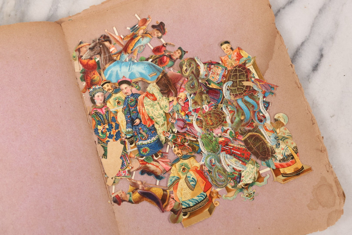 Lot 075 - Antique Die Cut Scrap Collection In Delicate Scrapbook, Containing Dozens Of Pieces, Mostly Made In Germany, Including People, Animals, Flowers, And Other Subjects, Not Glued To Book