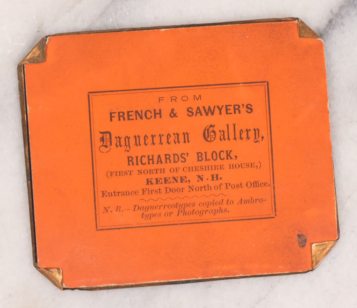 Lot 088 - Pair Of Antique Tintype Photographs Of Women Engaged In Knitting, Sewing Activities, Including Elderly Woman In Bonnet And Tintype In Brass Mat From French & Sawyer's Daguerreian Gallery, Keene, New Hampshire