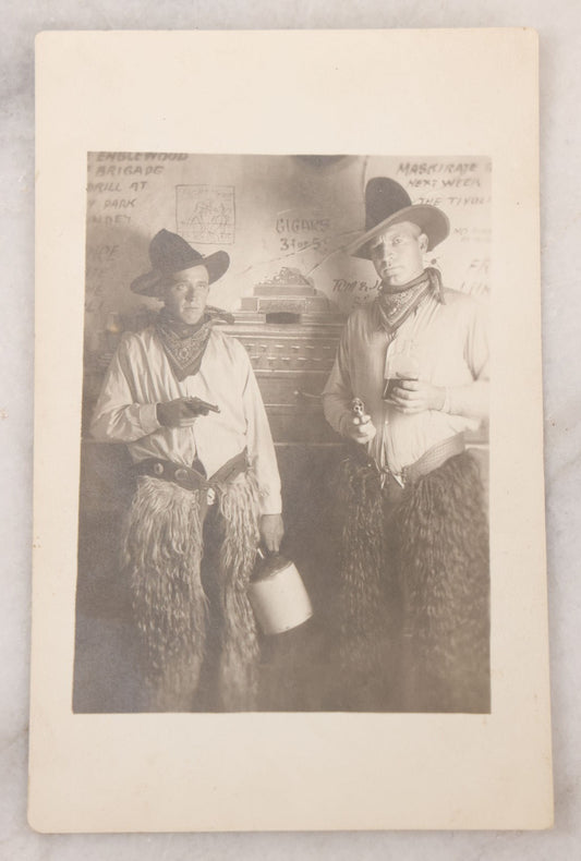 Lot 098 - Single Antique Real Photo Postcard R.P.P.C. Of Two Men Dressed As Cowboys Posing With Pistols And Whiskey