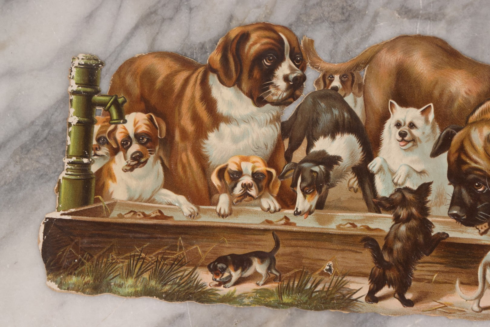 Lot 113 - Antique Lithographed Die Cut Scrap Of Dogs And Puppies Eating Out Of A Trough, Many Breeds Shown, Titled "The Dog's Dinner"