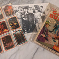 Lot 169 - Vintage Ephemera Grouping Including 18 Collectible Kiss Trading Cards, D.C. Gang Busters Comic No. 58, And Three Stooges Promo Photo