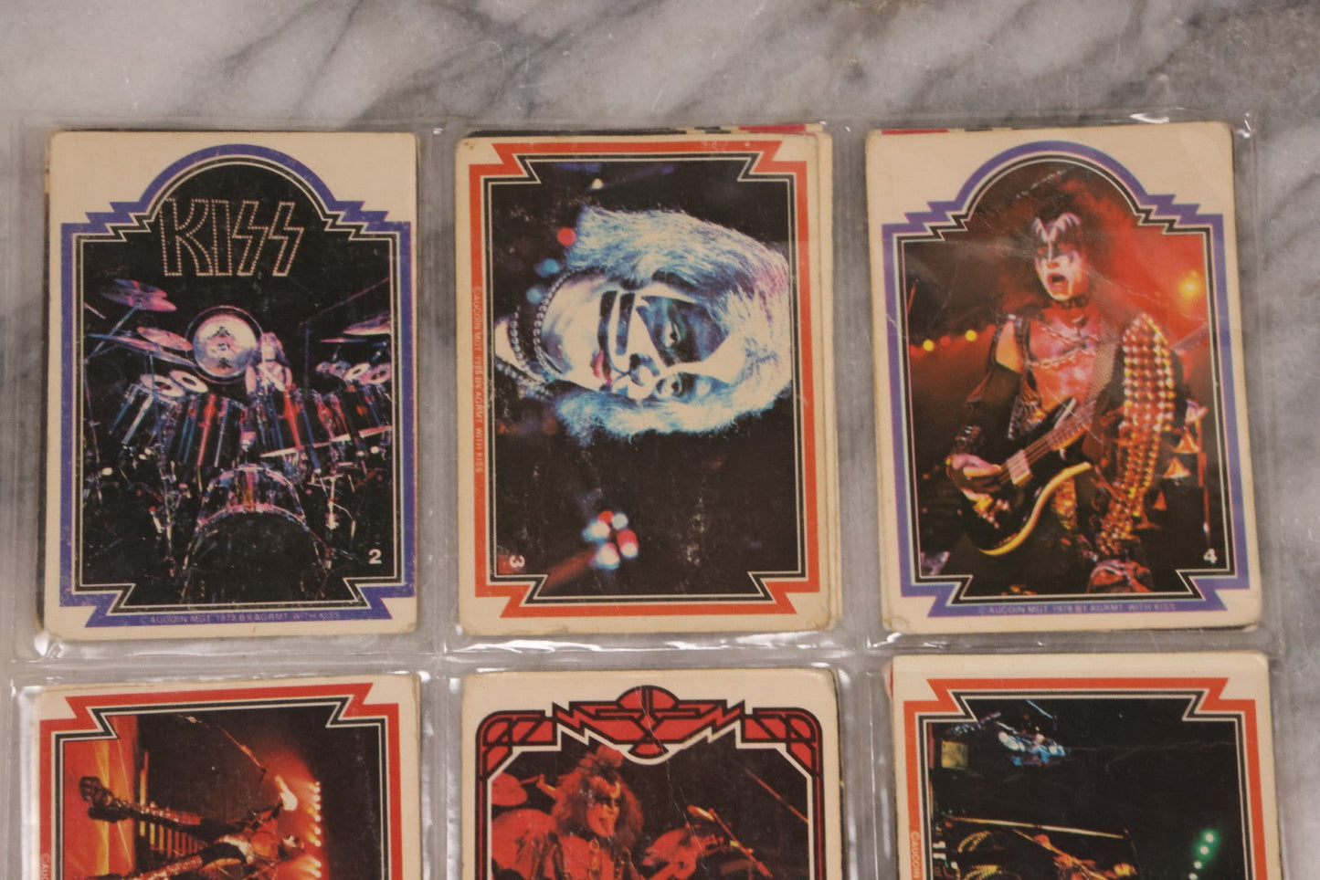 Lot 169 - Vintage Ephemera Grouping Including 18 Collectible Kiss Trading Cards, D.C. Gang Busters Comic No. 58, And Three Stooges Promo Photo