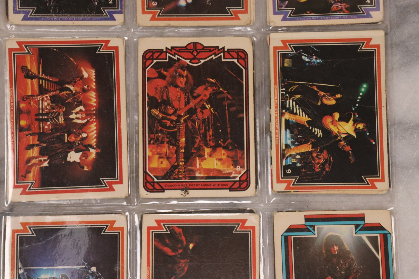 Lot 169 - Vintage Ephemera Grouping Including 18 Collectible Kiss Trading Cards, D.C. Gang Busters Comic No. 58, And Three Stooges Promo Photo