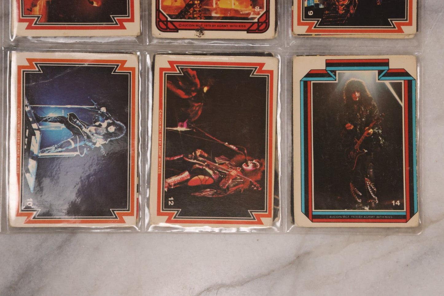 Lot 169 - Vintage Ephemera Grouping Including 18 Collectible Kiss Trading Cards, D.C. Gang Busters Comic No. 58, And Three Stooges Promo Photo