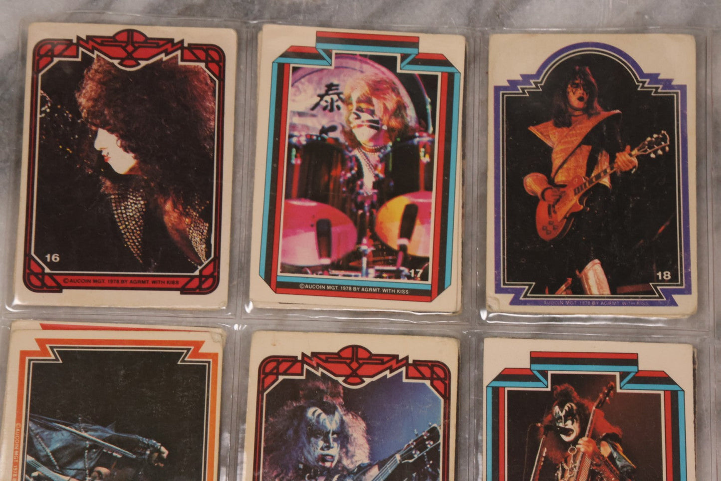 Lot 169 - Vintage Ephemera Grouping Including 18 Collectible Kiss Trading Cards, D.C. Gang Busters Comic No. 58, And Three Stooges Promo Photo