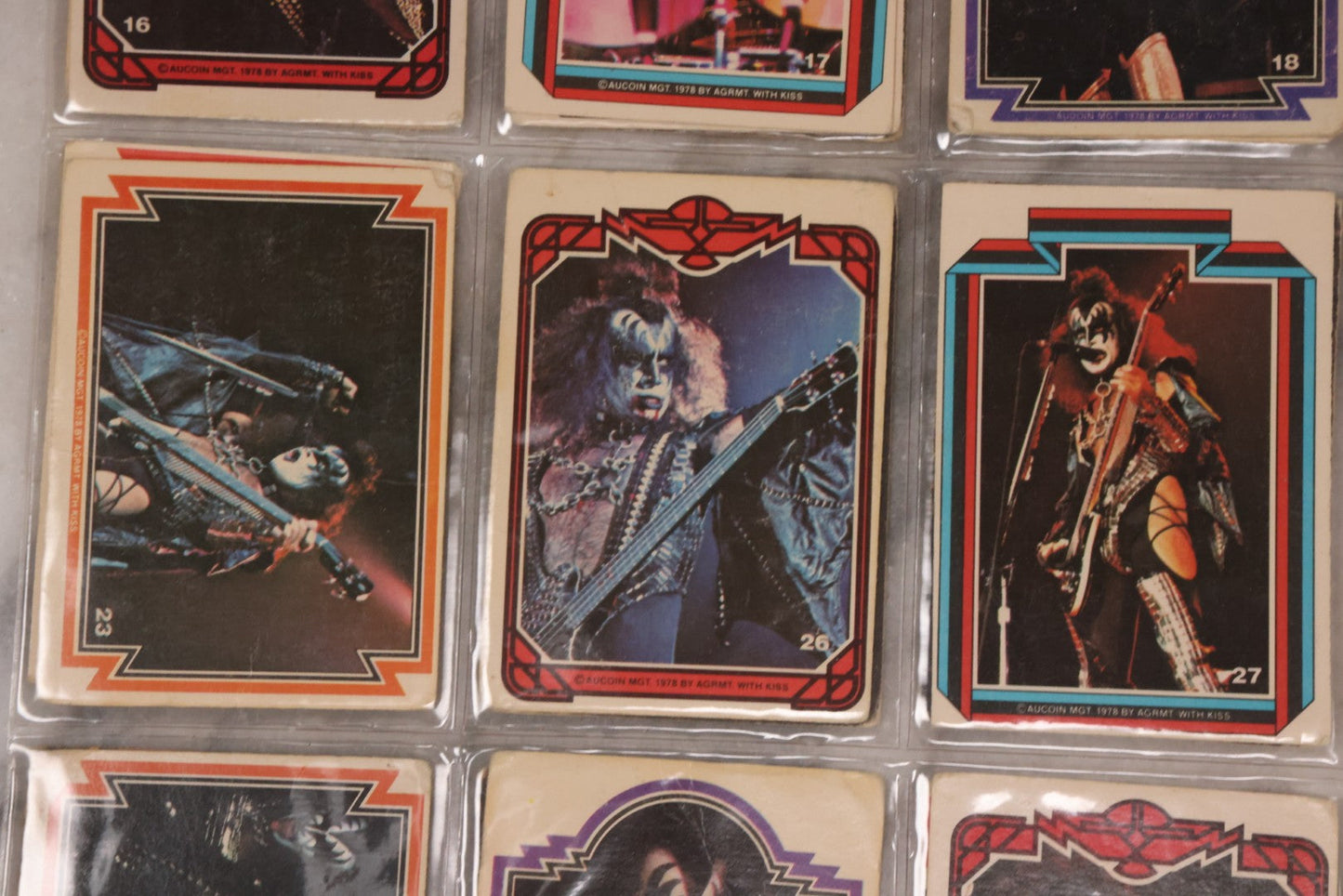 Lot 169 - Vintage Ephemera Grouping Including 18 Collectible Kiss Trading Cards, D.C. Gang Busters Comic No. 58, And Three Stooges Promo Photo